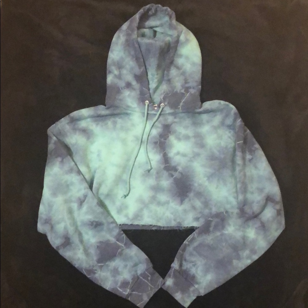 I am selling a blue, tie-dye, cropped hoodie.